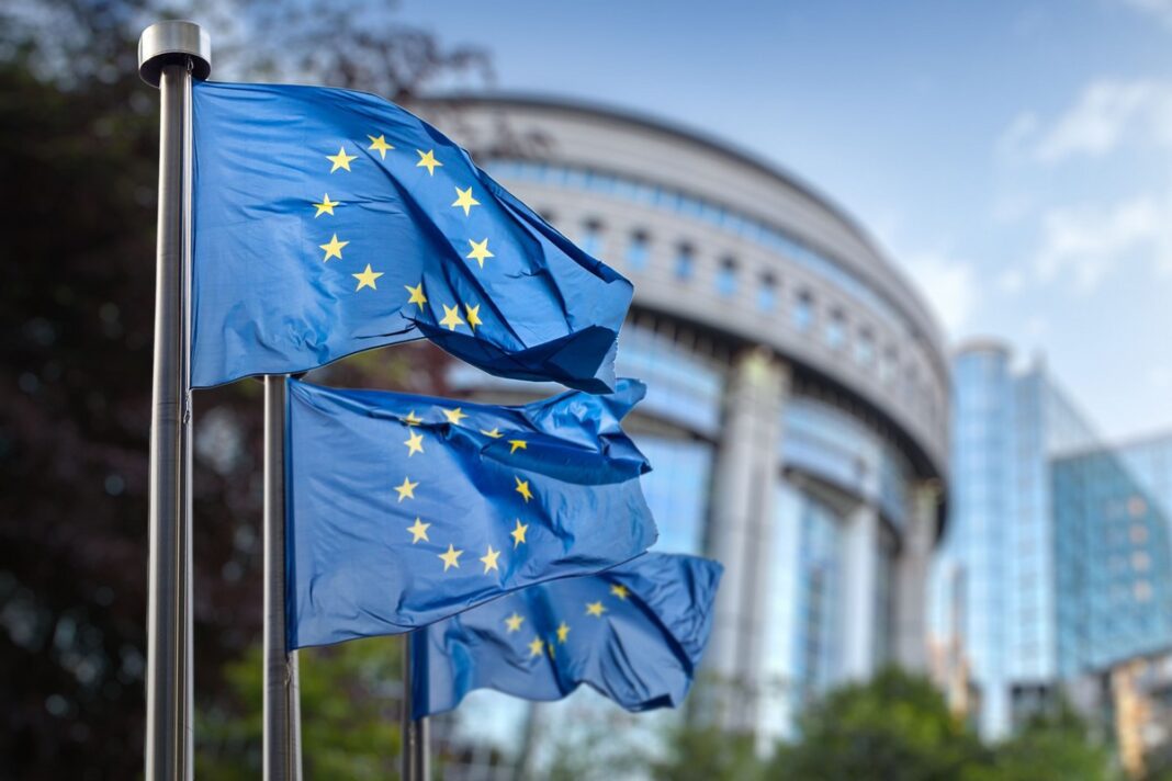 European,Union,Flag,Against,Parliament,In,Brussels,,Belgium